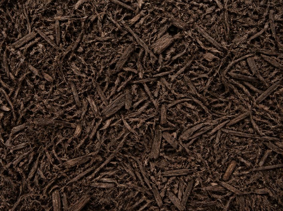 Close up of dark brown double-shredded mulch texture